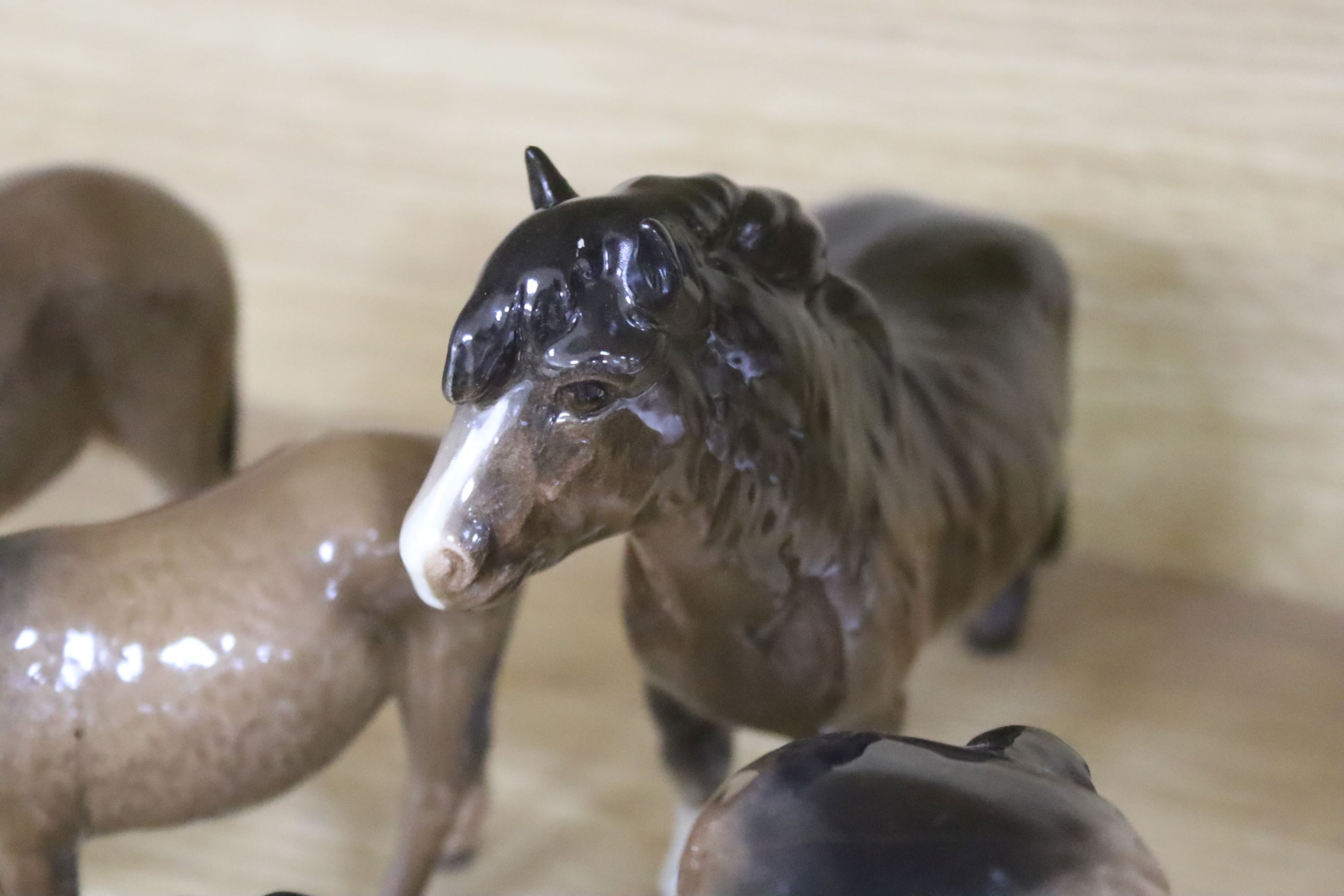 Four Beswick Shetland ponies and four Beswick donkeys